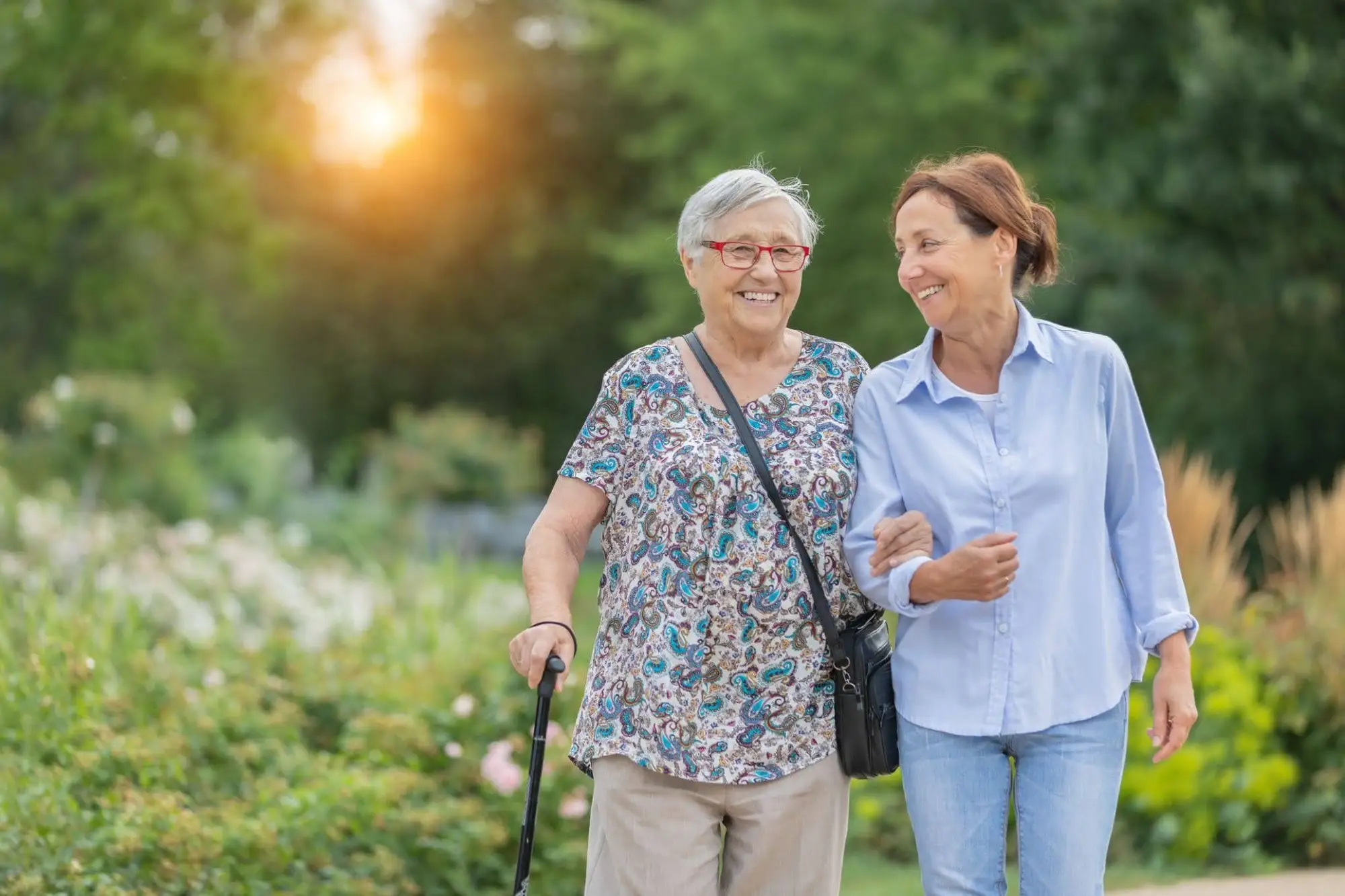 signs it might be time for assisted living in Matrinez GA blog An adult daughter walking with her senior mother and talking about signs it might be time for assisted living in Martinez, GA.